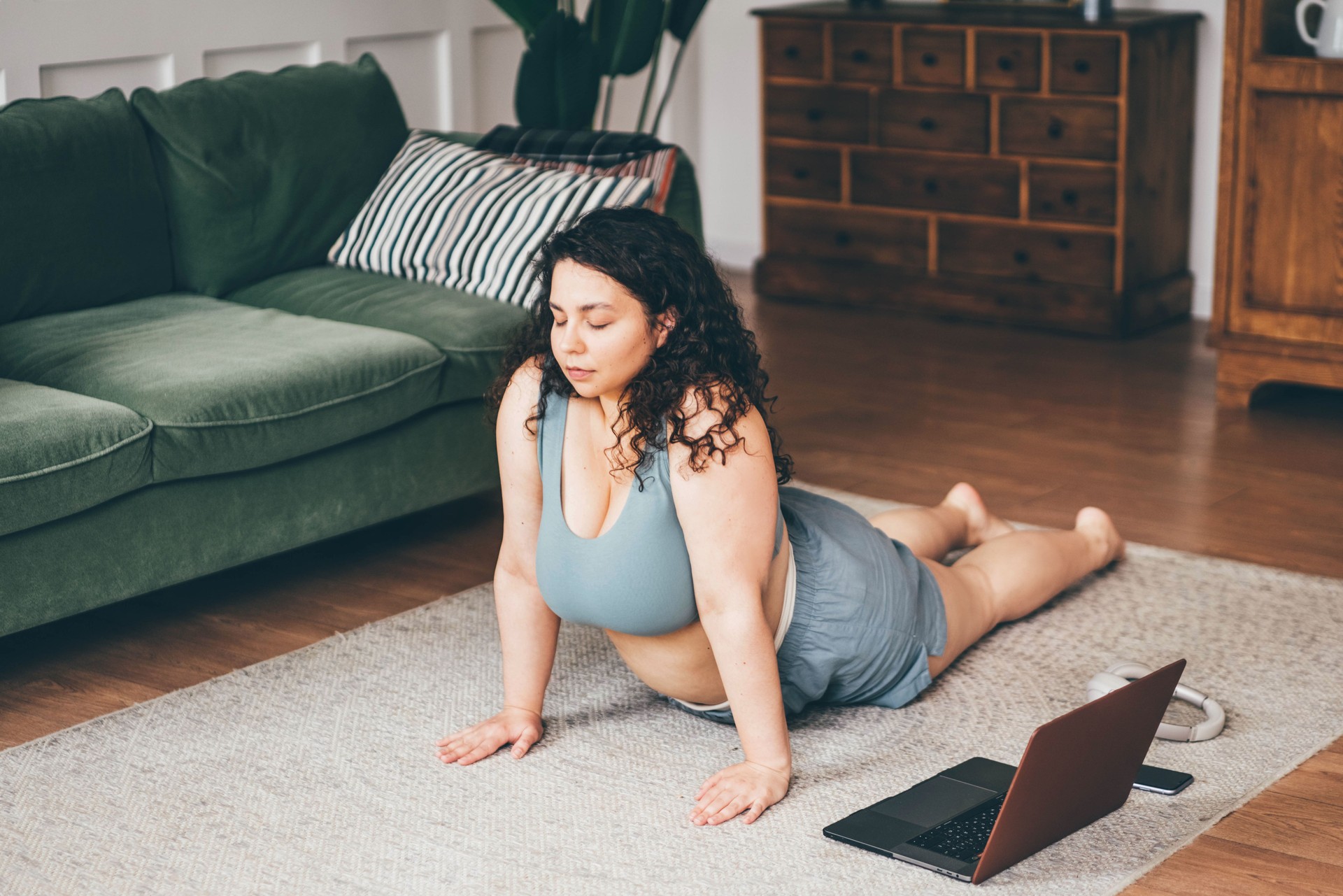 Plus size woman doing yoga and meditation at home. Plus size woman doing yoga and meditation at home.